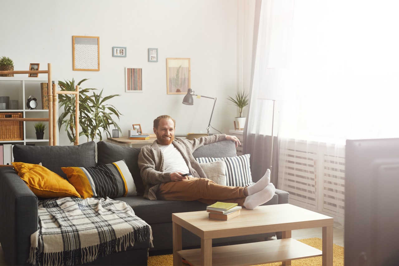 smiling man watching tv at home 2026 03 19 10 37 34 utc Large